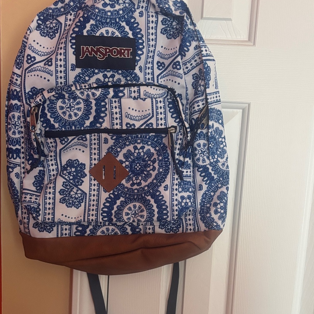 JanSport Blue and White Patterned Backpack with Brown Base